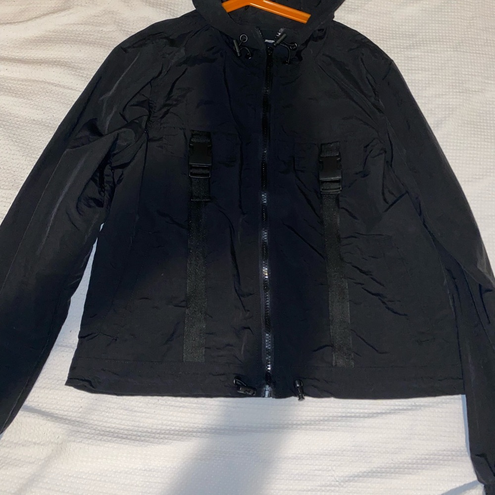 Black jacket with buckles